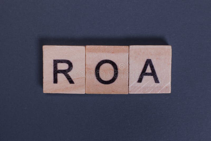 ROA Return On Assets from wooden letters on a gray background. Letters roa stock images, royalty-free photos and pictures