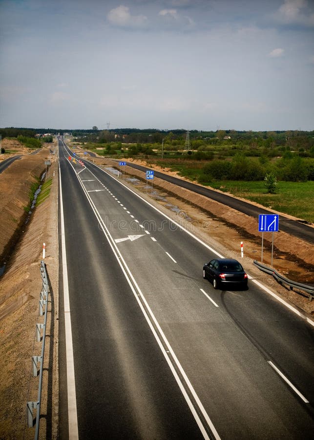 Lonely car on long road