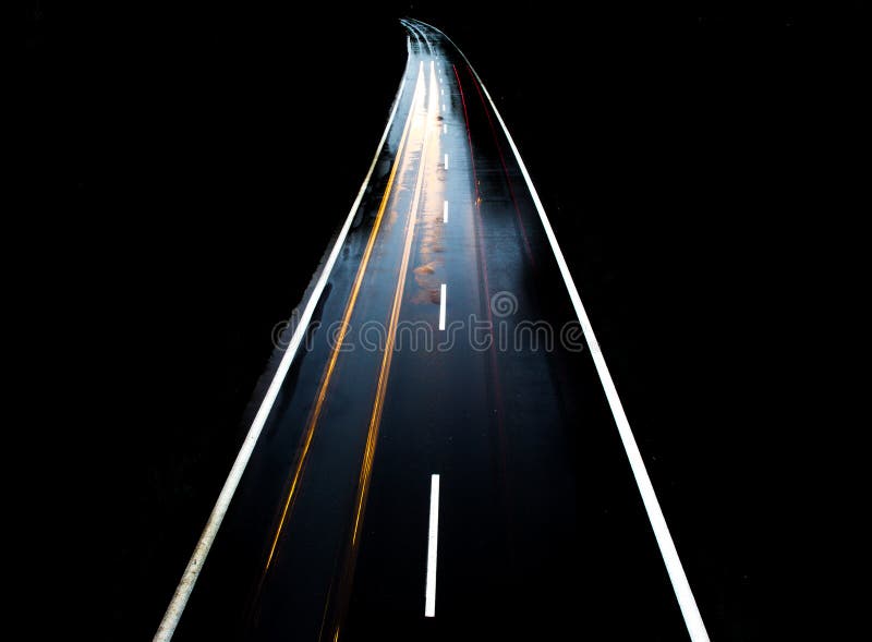 ROAD with CAR ALONE at NIGHT with BLURRY LIGHTS Stock Photo Image of
