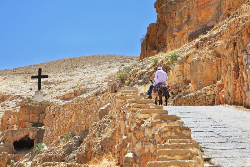 On the road climbs on a donkey pilgrim