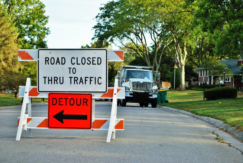 Road Closed To Thru Traffic Detour Construction Sign In A Residential