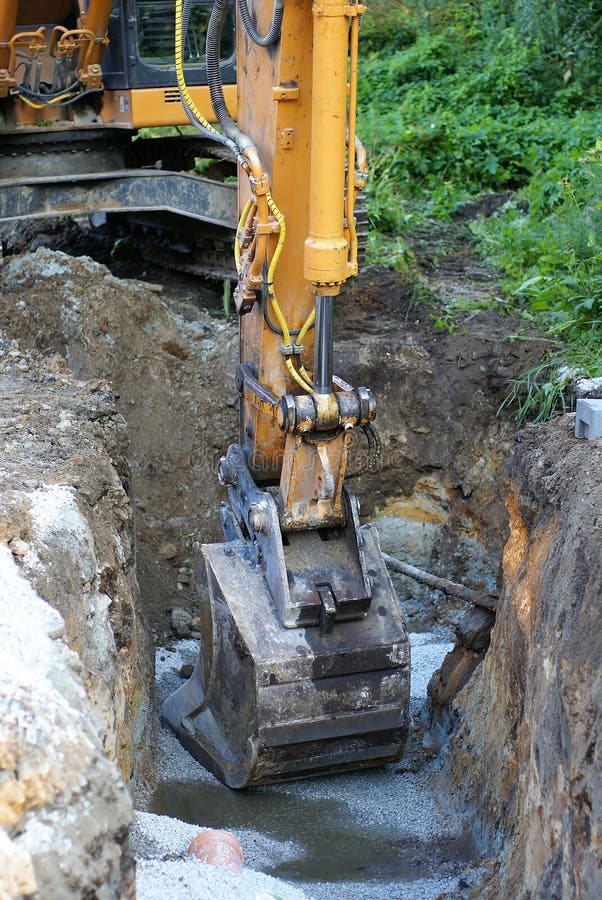 Road construction tractor excavator shovel grader. Track hoe construction excavator stock images, royalty-free photos and pictures
