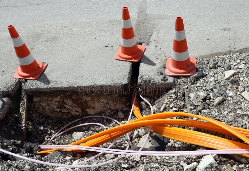 Road construction with pipes for laying optical fiber royalty free stock images