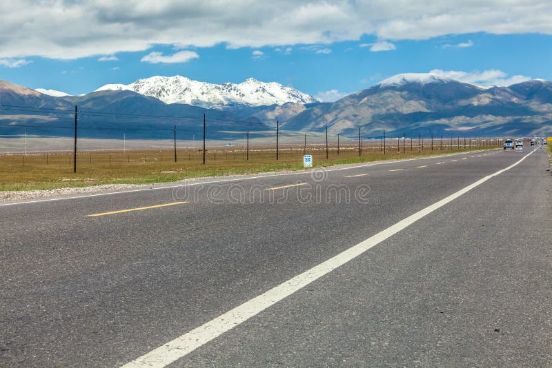 Road through the grassland stock photo. Image of line 127605510