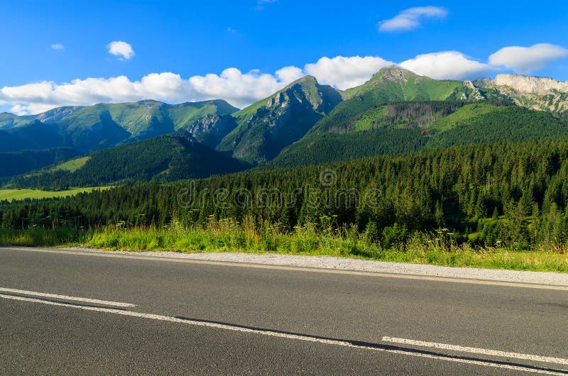 Road in green summer landscape of Tatra Mountains in Zdiar village, Slovakia