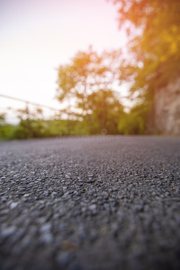 Road from the ground level with green bokeh background