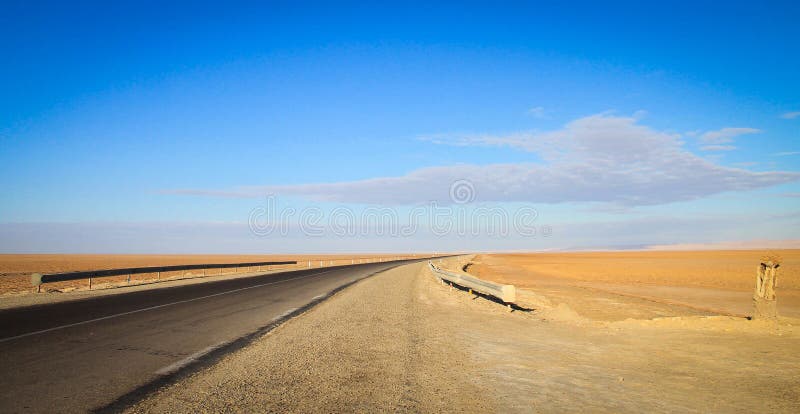 An empty Road into the horizon, the door to Sahara Desert, Douz, Tunisia