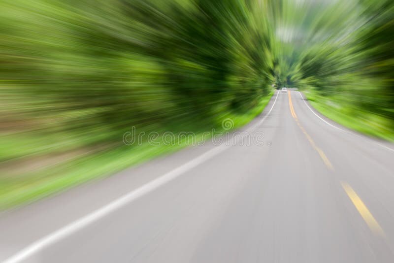 Road in motion speed on the forest road blurred background concept for Tunnel effect or Visual tunnel phenomenon royalty free stock photos Road in motion speed on the forest road blurred background concept for Tunnel effect or Visual tunnel phenomenon royalty free stock photos