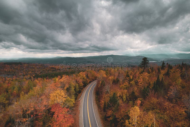 Road in the mountains with autumn color, in Abbot, Maine royalty free stock photo