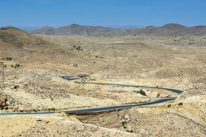 Road passing through Sahara desert royalty free stock image Road passing through Sahara desert royalty free stock image