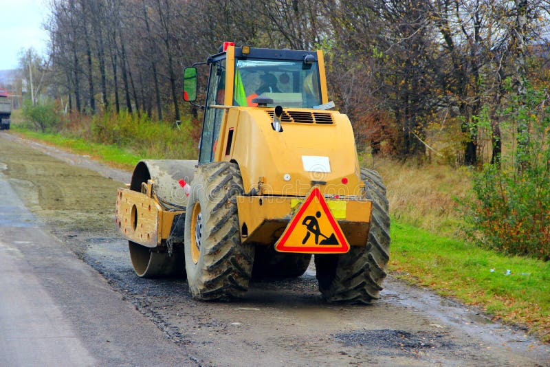 Roadroller on the road editorial stock photo. Image of transport