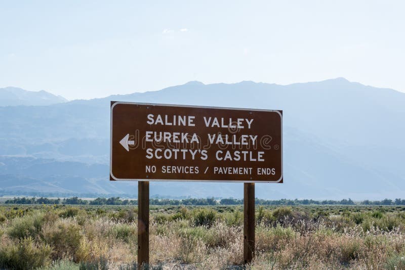 Road sign for Death Valley National Park points of interest - Scotty`s Castle, Eureka Valley and Saline Valley. No services on an stock images Road sign for Death Valley National Park points of interest - Scotty`s Castle, Eureka Valley and Saline Valley. No services on an stock images