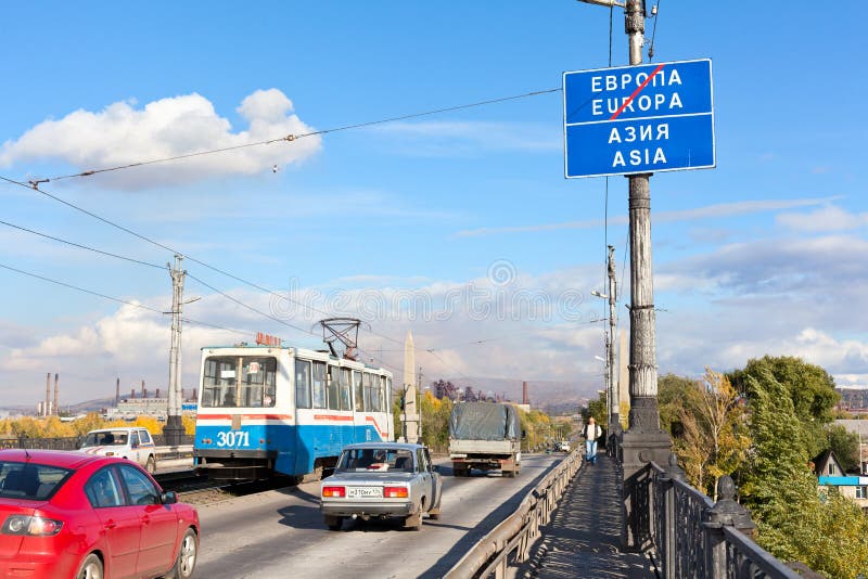 Road sign about Europe and Asia border. MAGNITOGORSK, RUSSIA – SEPTEMBER 27: Plate with the inscription of the border between Europe and Asia on September 27 stock image Road sign about Europe and Asia border. MAGNITOGORSK, RUSSIA – SEPTEMBER 27: Plate with the inscription of the border between Europe and Asia on September 27 stock image