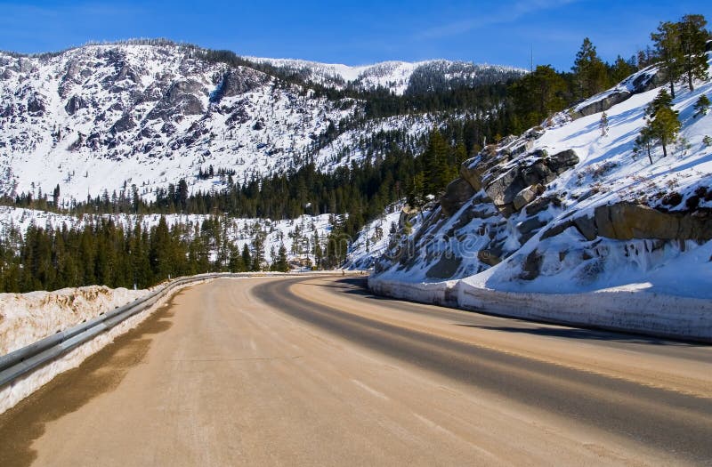 Road through snowy mountains