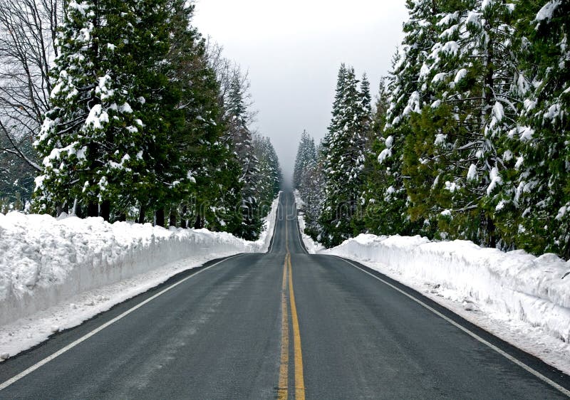 Road through snowy mountains