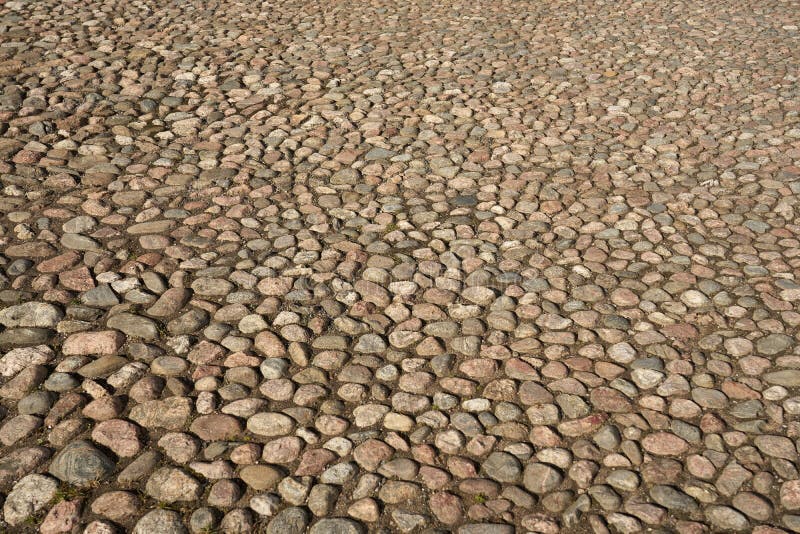 The Road Surface is Made of Ancient Stones. Stock Photo Image of