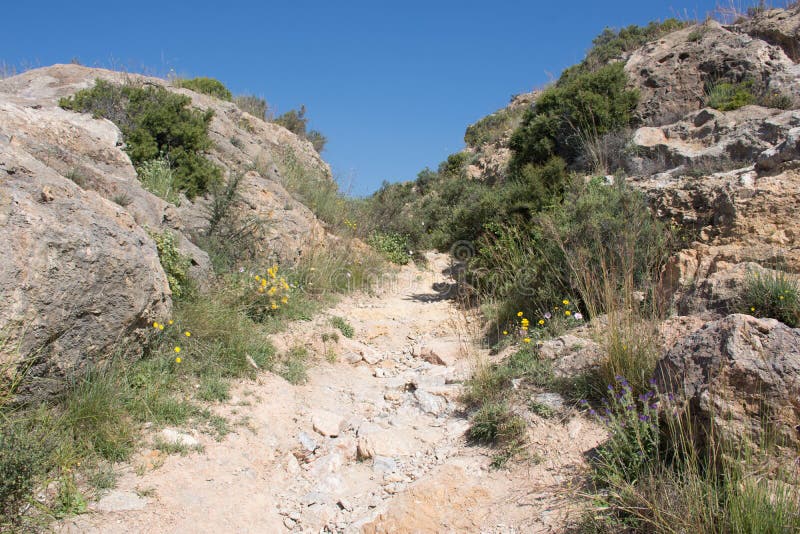 The road to an abandoned castle on top of a mountain in Spain