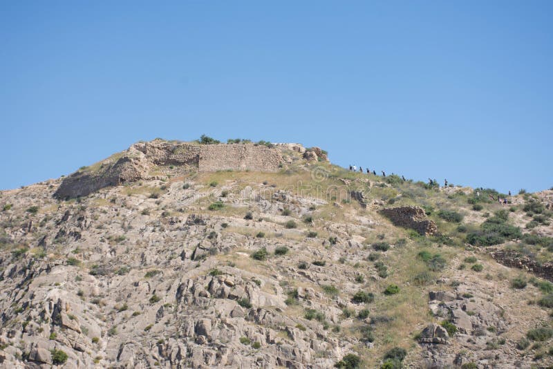 The road to an abandoned castle on top of a mountain in Spain