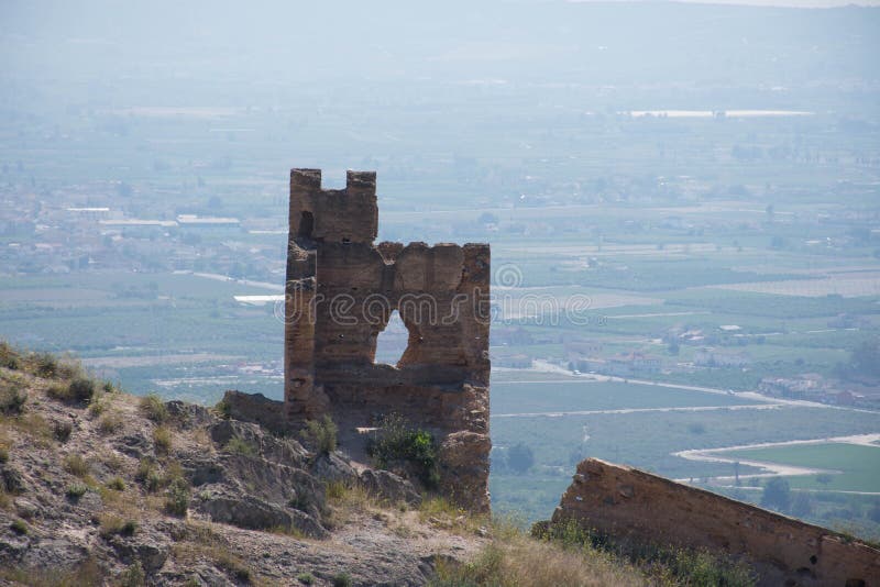 The road to an abandoned castle on top of a mountain in Spain