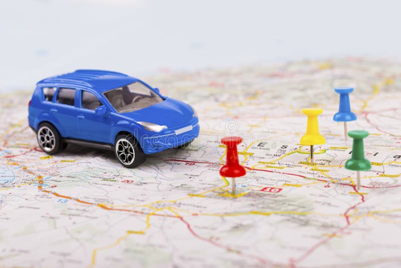 Road trip concept, car with destination points on map royalty free stock photo