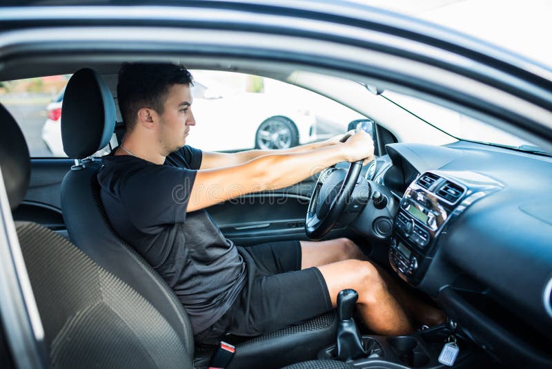 Road trip, transport, travel and people concept - happy smiling man driving car stock photography Road trip, transport, travel and people concept - happy smiling man driving car stock photography