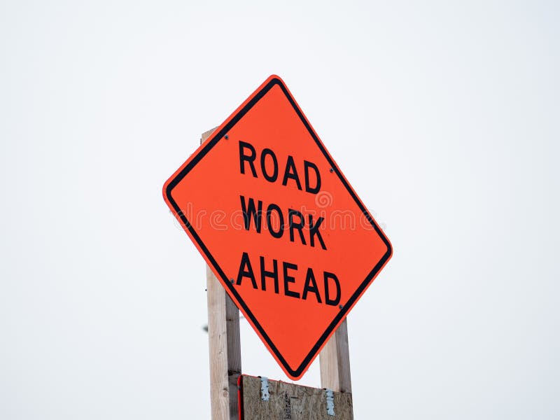 Attention build. Road work ahead. Road work ahead sign.