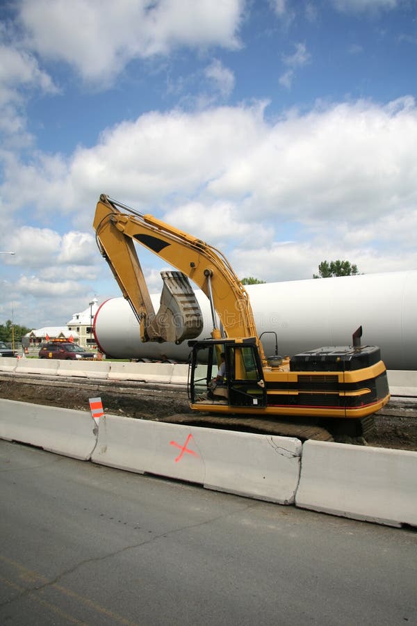 Roadside Construction Excavator Building Out Roadway. Track hoe construction excavator stock images, royalty-free photos and pictures