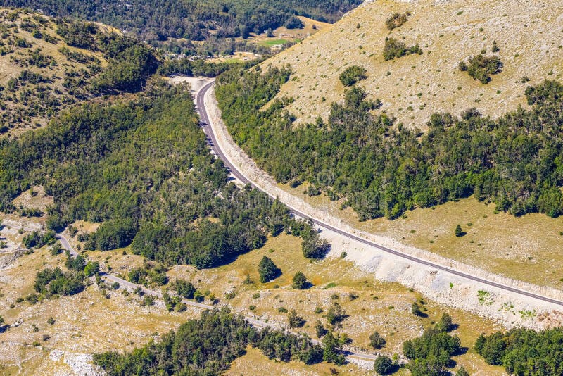 Roadway among the mountains, in the Lovcen national Park in Montenegro. The view from the top royalty free stock image Roadway among the mountains, in the Lovcen national Park in Montenegro. The view from the top royalty free stock image