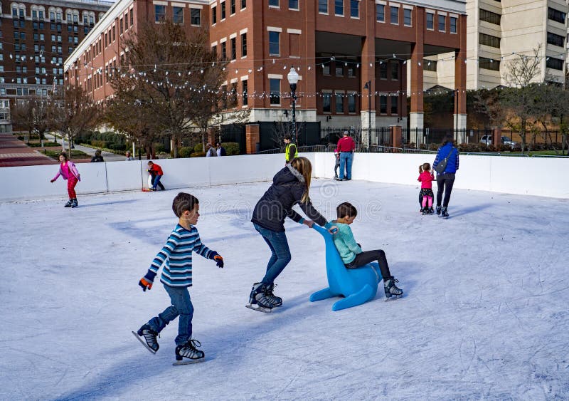 Roanoke, VA â€“ November 27th: Families enjoy ice skating at the outdoor ice rink located in Elmwood Park on November 27th, 2017, Roanoke, Virginia, USA. Roanoke, VA â€“ November 27th: Families enjoy ice skating at the outdoor ice rink located in Elmwood Park on November 27th, 2017, Roanoke, Virginia, USA.