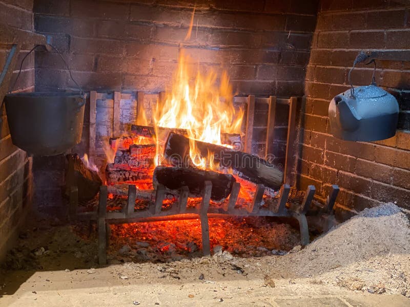 A Roaring Fire in a Fireplace. Stock Photo Image of roaring, iron