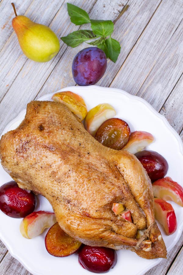 Roast Duck with Plums and Apples. Stock Photo - Image of dark, chicken ...