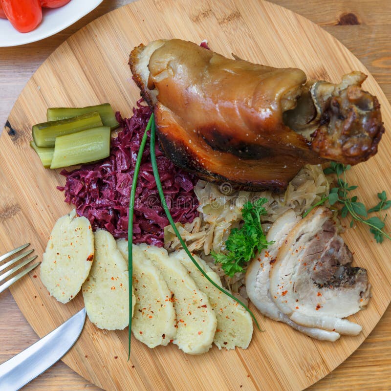 Roast Pork Knuckle Served with Boiled Cabbage, Bread, Horseradish and