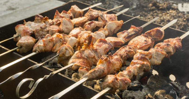 Roast Pork Meat on Skewers Shish Kebab from Meat on the Grill Stock ...