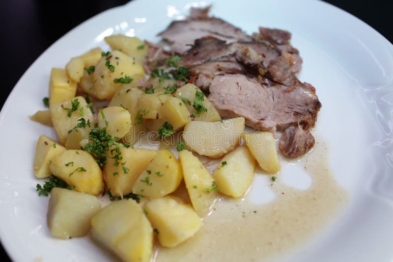 Roast pork with potatoes stock image. Image of lunch 41770979