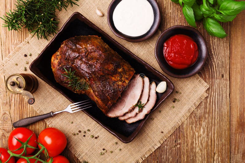 Roast Pork with Tomato Dip, Dip with Garlic and Herbs Stock Photo