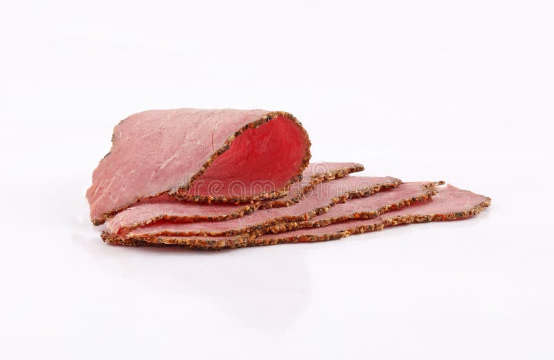 Slices Perfectly Arranged of Roast Beef on White Background Stock Image