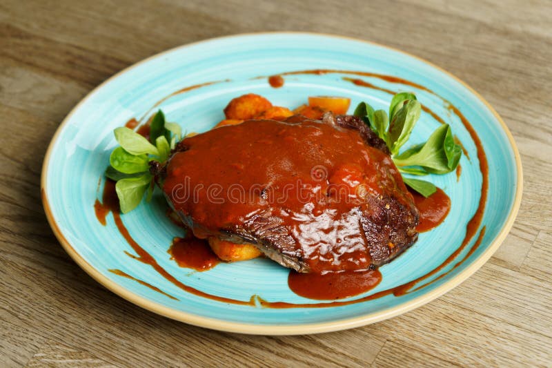 Roasted Beef, Rib Eye with Sauce, Potato and Vegetables Stock Photo