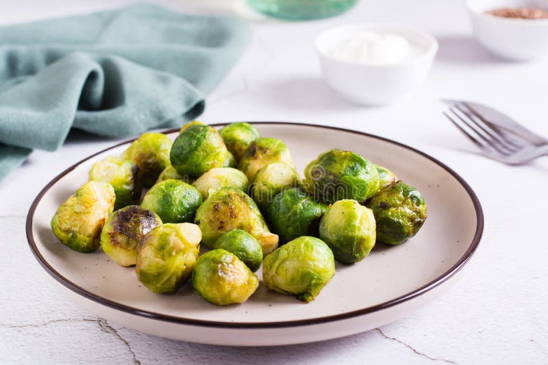 Roasted Brussels Sprouts on a Plate on the Table. Vegetarian Diet Stock Image Image of