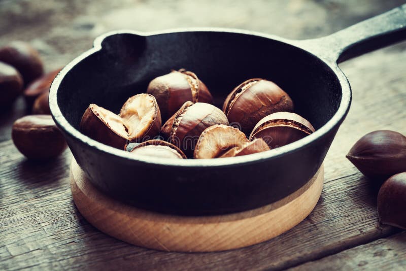 Roasted chestnuts on frying pan.