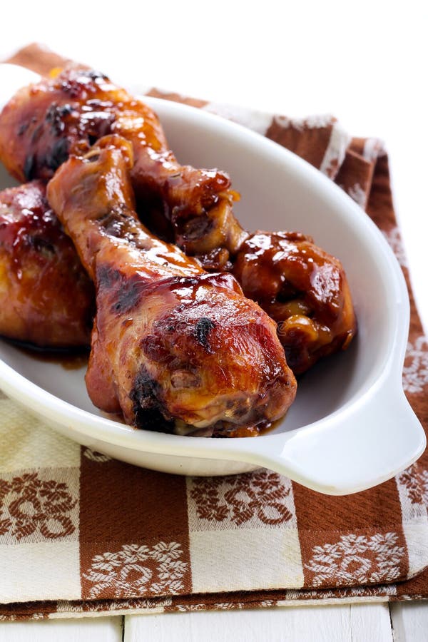 Roasted chicken drumsticks stock image. Image of gravy 62962567