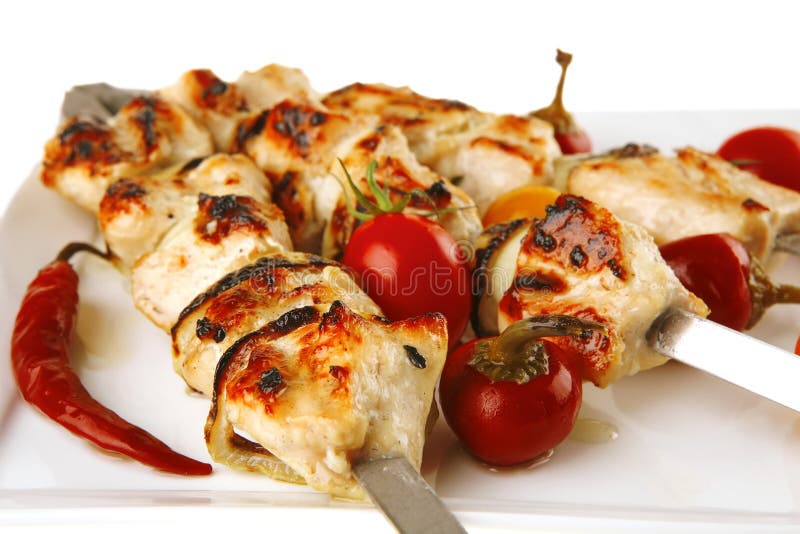 Fresh roast chicken shish kebab on white platter. Roasted skewer grill stock images, royalty-free photos and pictures
