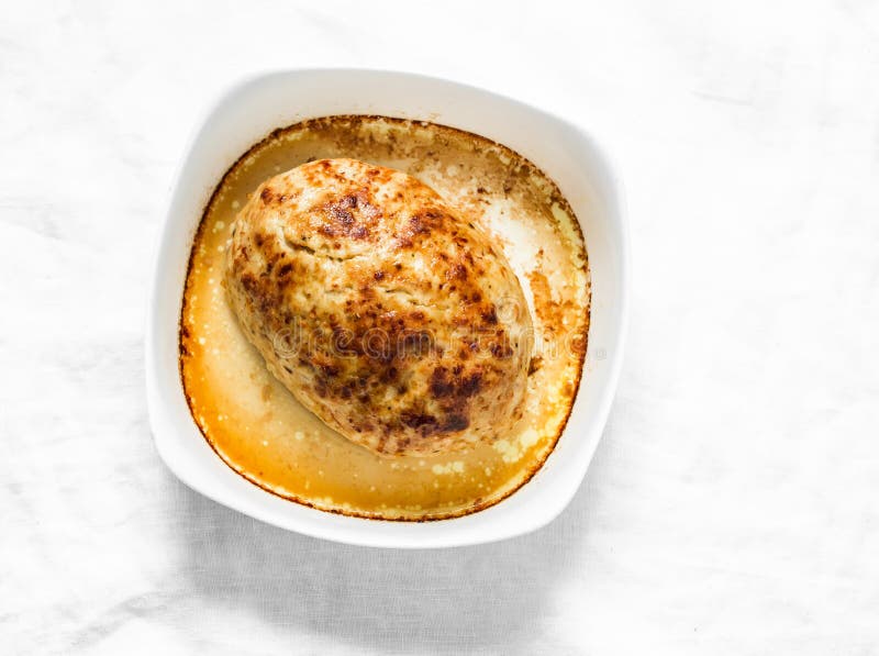 Roasted Chicken Meatloaf in a Baking Dish on a Light Background, Top