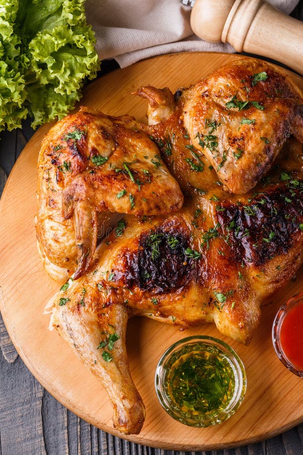 Roasted Chiken on Wooden Board with Sauce Stock Photo - Image of ...