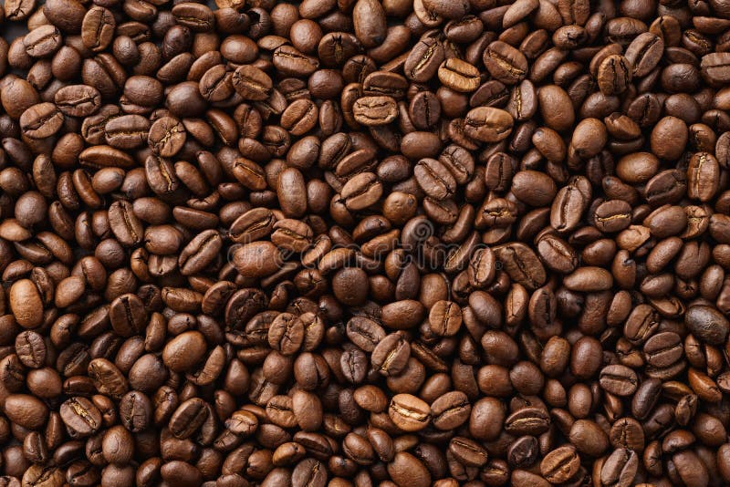 Roasted coffee beans background. Top view. Space for text