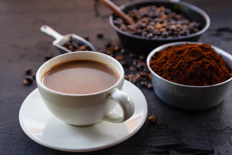.Roasted Coffee Beans with Coffee Powder and Coffee Cups Stock Image