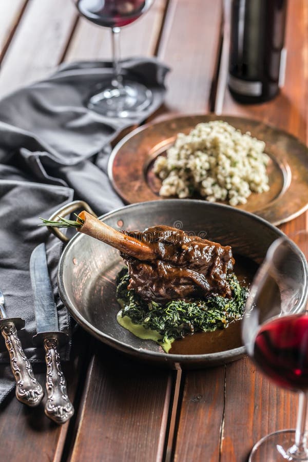 Roasted or Confit Lamb Leg in Pan with Spinach and Red Wine Stock Image Image of bone, dining