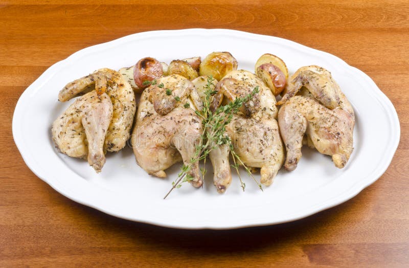 Roasted Cornish Game Hen and Potatoes Stock Photo Image of roasted