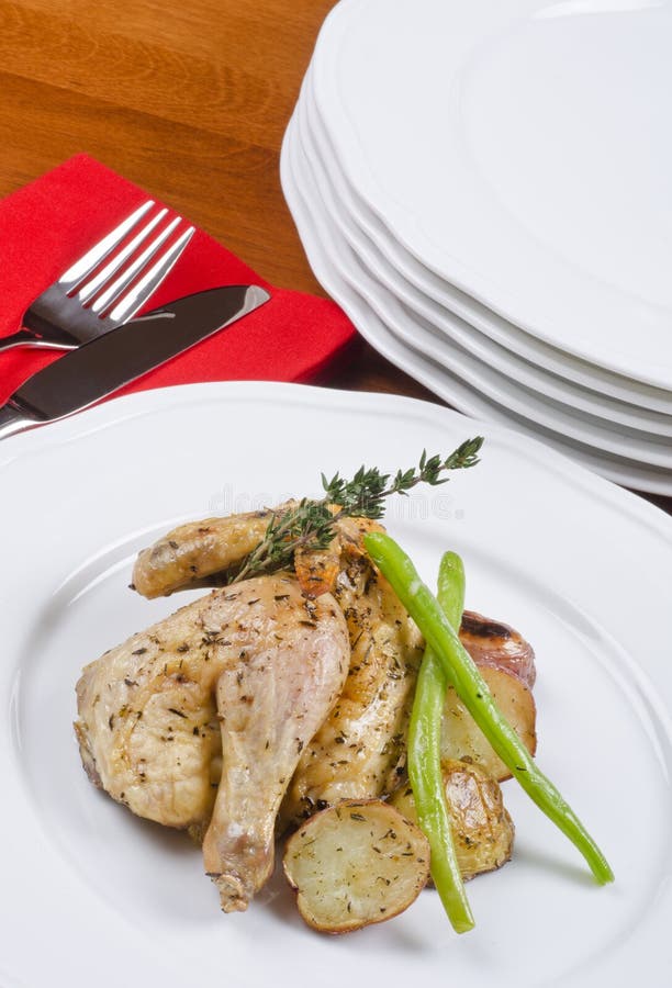 Roasted Cornish Game Hen Served and Potatoes Stock Photo Image of