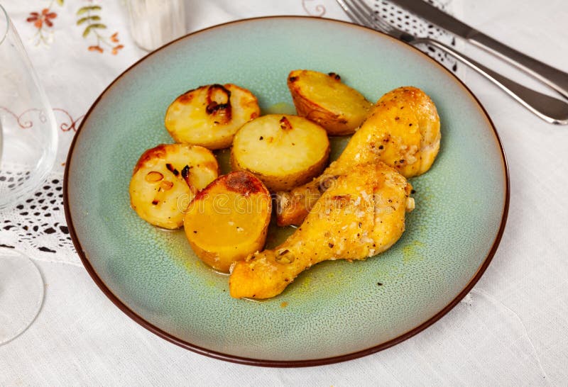 Roasted Drumsticks and Potatoes Served on Table Stock Photo Image of