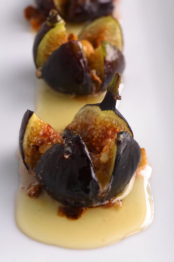 Roasted Figs in Mascarpone Cheese Honey and Hazelnuts Stock Photo
